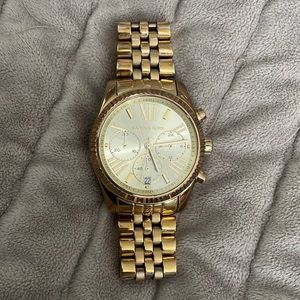 Woman’s Michael Kors gold color watch